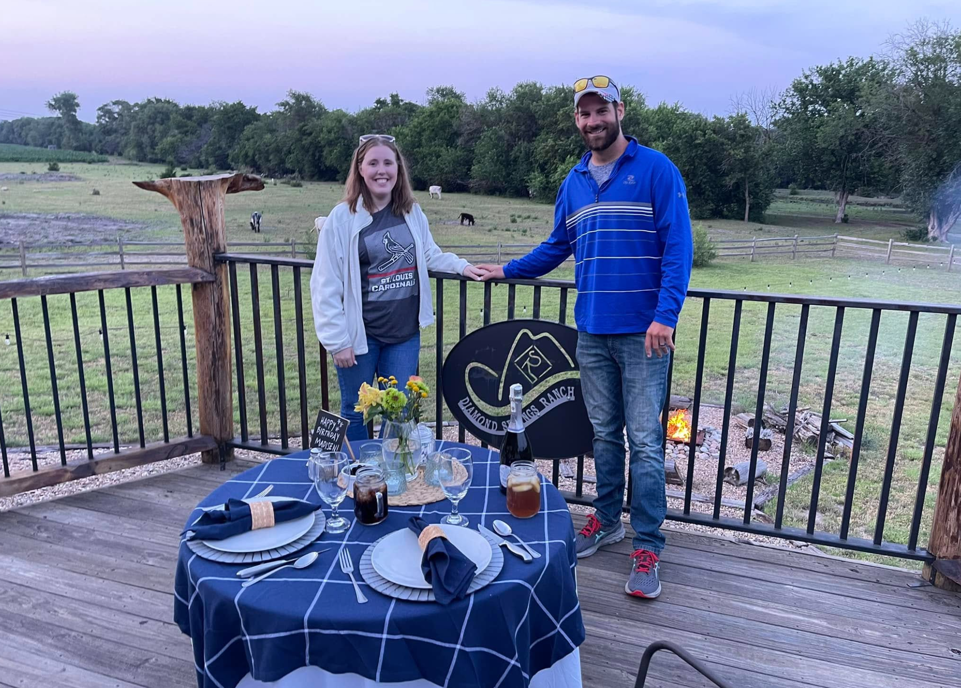 Couple at dinner table with ranch view